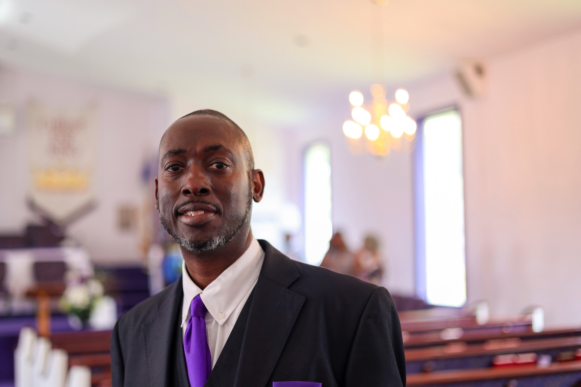 A portrait of a black man in church